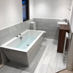 a bathroom with a tub and sink